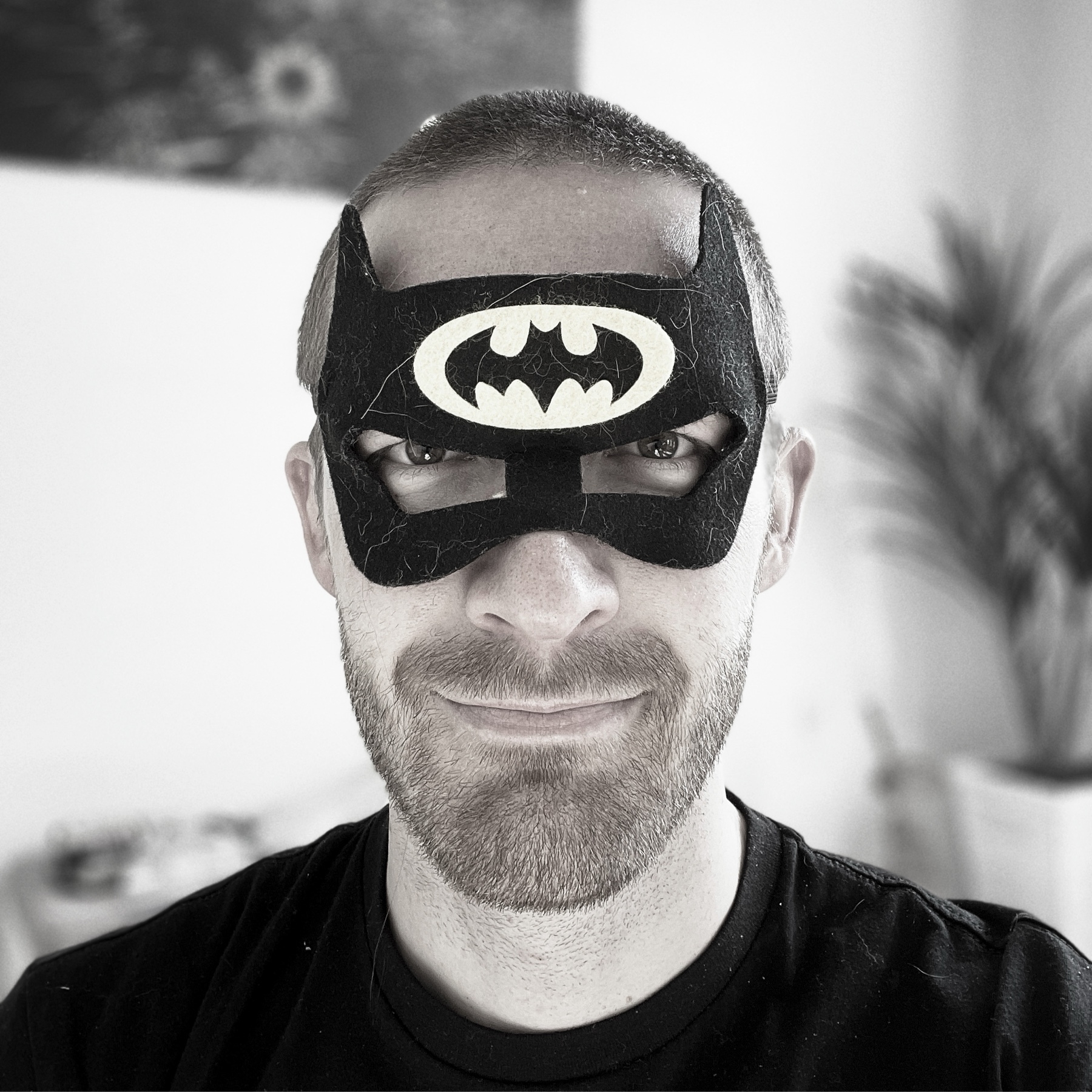 man wearing a Batman mask