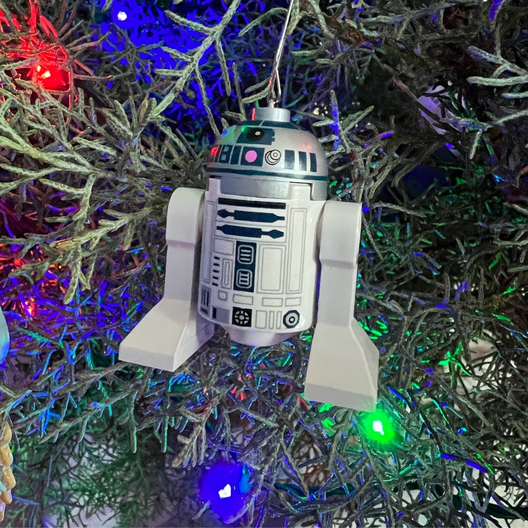 R2-D2 ornament on a Christmas tree